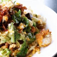 Club Salad · Crispy chicken, mixed greens, tomato, avocado, smokehouse bacon, mixed jack and cheddar chee...