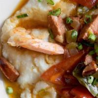 Shrimp & Grits · Smoky andouille sausage, jumbo shrimp, aromatic vegetables, blackening seasoning and fresh t...
