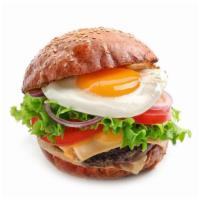 Texas Burger · Juicy beef patty, fresh egg, onions, lettuce, tomato, jack cheese on a fresh bun.