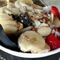 Pitaya · Topped with granola, strawberry, banana, blueberries, coconut shavings, honey and chia seeds