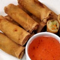 Veggie Spring Rolls ( 5 Pcs ) · Fried vegetable spring roll serve with spicy sweet sauce.
