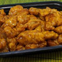 Orange Chicken (1/2 Lb.) · Breaded boneless  chicken chunks, fried until crispy brown,  served with orange sauce (orang...