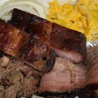 3 Meat Plate · Choose 3 generous portions of our delicious slow smoked meats and 2 homemade sides.