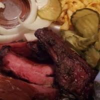 1 Meat Plate · Choose one generous portion of our delicious slow smoked meats and two homemade sides.