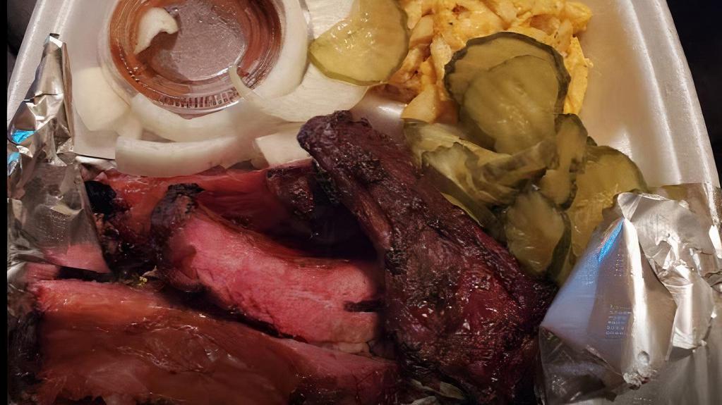 1 Meat Plate · Choose one generous portion of our delicious slow smoked meats and two homemade sides.