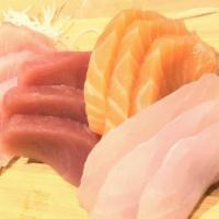 Sushi & Sashimi Deluxe · Chef's assortment of 8 pieces sashimi and 5 pieces sushi with tuna roll