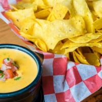 Chile Con Queso & Chips · Charred jalapenos/ corn tortilla chips.