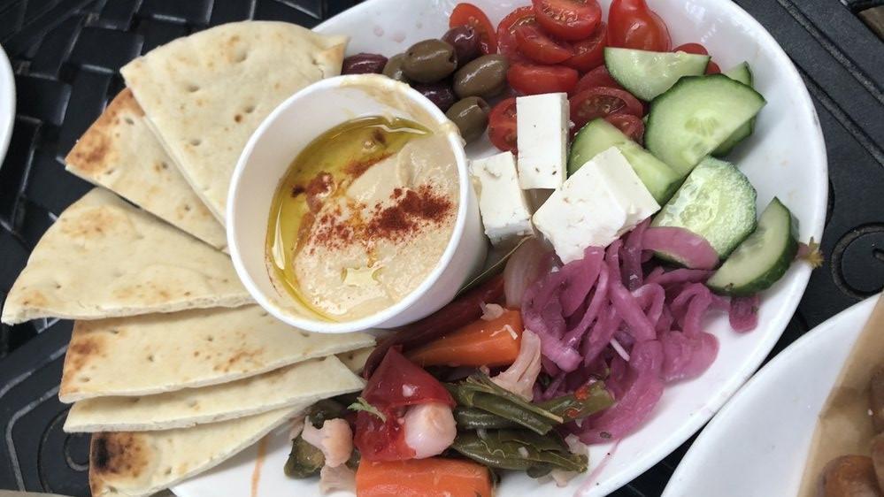 Hummus · Marinated olives, veggies, feta, pita bread