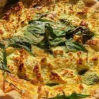 Spinach & Goat Cheese Quiche · Baby spinach leaves piled high with smooth, soft French goat cheese.