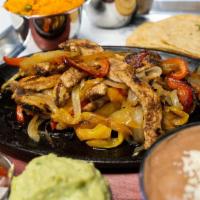 Fajitas Chicken · Flour tortillas with your choice of meat with onions, green pepper, and tomatoes cream.