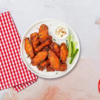 Chicken Wings · Fresh chicken wings fried and tossed in your choice of sauce. Served with your choice of dip...