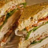 Towering Turkey, Bacon & Avocado Club Sandwich · Double decker club sandwich. Dijonnaise, roasted turkey, bacon, avocado, tomato and arugula....