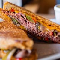One Of A Kind Grilled Roast Beef Sandwich · One of a kind grilled roast beef on sourdough bread with European butter, medium cooked roas...
