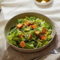 Caesar Salad · Romaine lettuce with savory croutons, fresh Parmesan cheese, and creamy Caesar dressing.