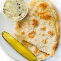 Vegetable Quesadilla · Assorted vegetables, bean spread, and jack cheese folded into a flour tortilla.