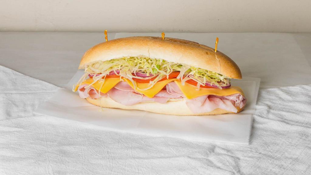 Ham & Cheese Sandwich · Deluxe ham, Am. cheese, lettuce, tomatoes, onions, oil and vinegar, mayo.