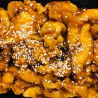 Sesame Chicken · Served with fried rice or white rice and egg roll or crab rangoon.