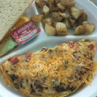 Veggie Omelet  · Three egg omelet filled with spinach, mushrooms, tomatoes, and shredded cheese. Served with ...