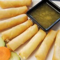 Cheese Rolls (8) · Fried roll of cream cheese served with butter pineapple sauce.
