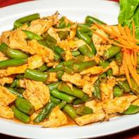 Pad Prik King · Red curry sauce with green beans and lime leaf.
