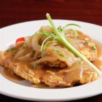 Center Cut Pork Chop(S) Topped With Gravy & Onions (Large (2)) · Two center-cut pork chops fried and topped with sautéed onions and brown gravy