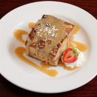 Banana Rum Bread Pudding · Our signature bread pudding is made from fresh brioche topped with homemade rum sauce and ho...