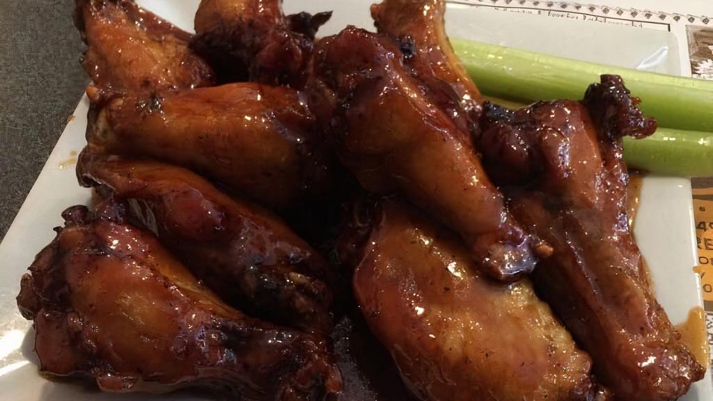 Jack Daniel Chicken Wings · (8) Fried and tossed with bourbon, honey, BBQ sauce and butter.
