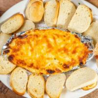 Hot Crab Dip · Toasted French baguette.