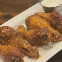 Buffalo Drummies · Wing-Sized chicken drumsticks tossed with house buffalo sauce served with your choice of ran...