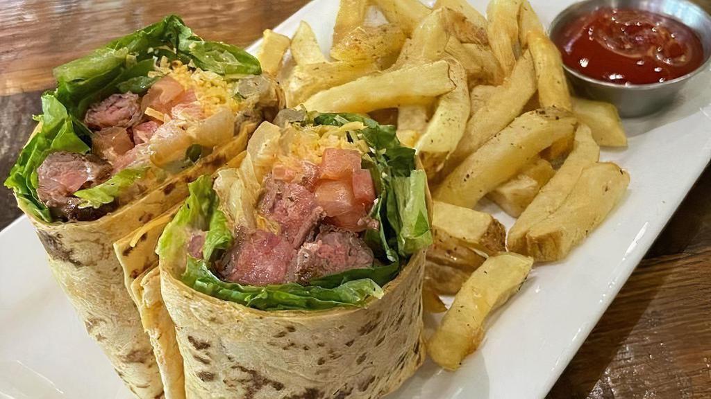 Chimichurri Wrap · Sun-dried tomato tortilla, grilled Certified Angus Beef, cheese blend, romaine, sauteed onions, tomato, chimichurri sauce and chipotle cilantro mayo