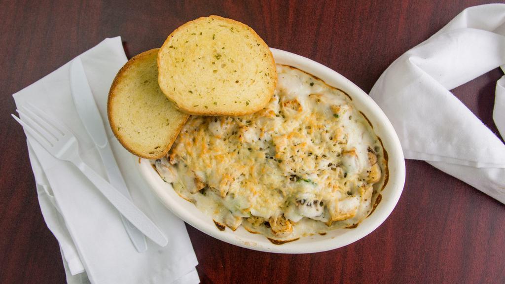 Chicken Fettuccine Alfredo · Grilled marinated chicken breast, sautéed broccoli, and mushrooms in creamy alfredo sauce, served over fettuccine and topped with shredded Parmesan cheese.