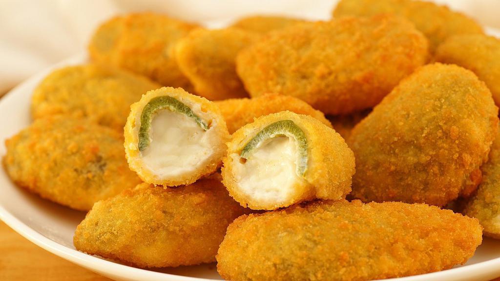 Jalapeño Poppers · 6 Large Cream Cheese Stuffed Jalapeno's breaded to  a light crisp served with a side of marinara sauce