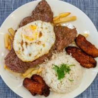 Bistec A Lo Pobre · 11 oz. of sirloin steak served with french fries, plantains, eggs, and white rice.

Consumin...