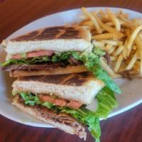 Torta De Milanesa W/ Fries · Mexican sandwich with breaded steak, beans, guacamole, pico and lettuce. Served with French ...