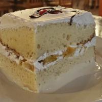 Pastel De Tres Leches · Filled with peaches