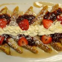 French Toast · Strawberries, homemade strawberry jam, maple syrup, whipped cream.
