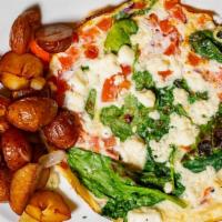 Veggie Omelet · Tomatoes, mushrooms, broccolini, house blend cheeses, with breakfast potatoes.