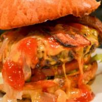 Gf Burger · Cheddar, bacon, lettuce, tomato, onion, smoked sriracha ketchup, brioche.