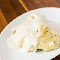 Whipped Potatoes · Skin and whipped with cream and garlic butter. Served with cream gravy