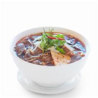 Bún Bò Hue · Spicy beef noodle soup with pork blood and pork knuckle.