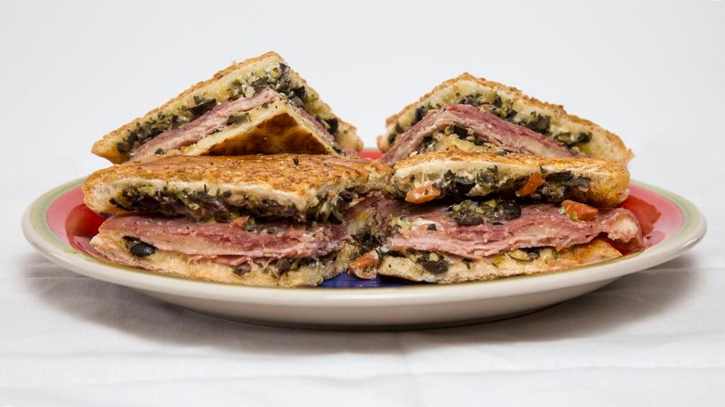 
Whole Muffuletta · It’s filled with ham, salami, mortadella, provolone cheese, & olive salad dressing.