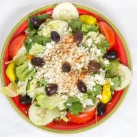 Greek Salad · Iceberg and romaine lettuce tomato,cucumber pepperoncini ,kalamata olives topped with feta c...