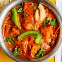 Butter Chicken · Barbecued chicken breast cooked in our fresh, creamy, tomato-based sauce.
