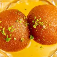 Gulab Jamun · Fried milk balls soaked in sweet syrup; served hot.