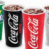 Soda - 32 Oz · Choose from Coca Cola, Sprite, Dr. Pepper, Fanta Orange, water bottle, root beer, or Gold Pe...