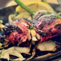Tandoori Chicken · Half Chicken marinated with yogurt and spices then roasted in Clay Oven.