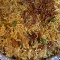 Fried Rice · Lightly flavored rice cooked with peas and onions.