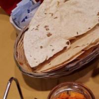 Paratha · Pan-fried layered bread with crispy outer layer.