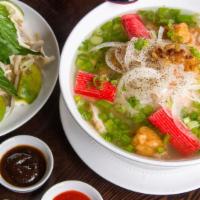 Pho Hai San · Peeled shrimps, fish balls, imitation crab meats in Chicken broth served with Pho Noodles