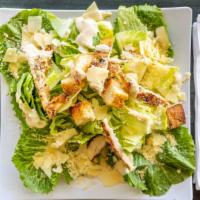 Chicken Caesar Salad · Crispy romaine, homemade caesar dressing, topped with parmesan and croutons.